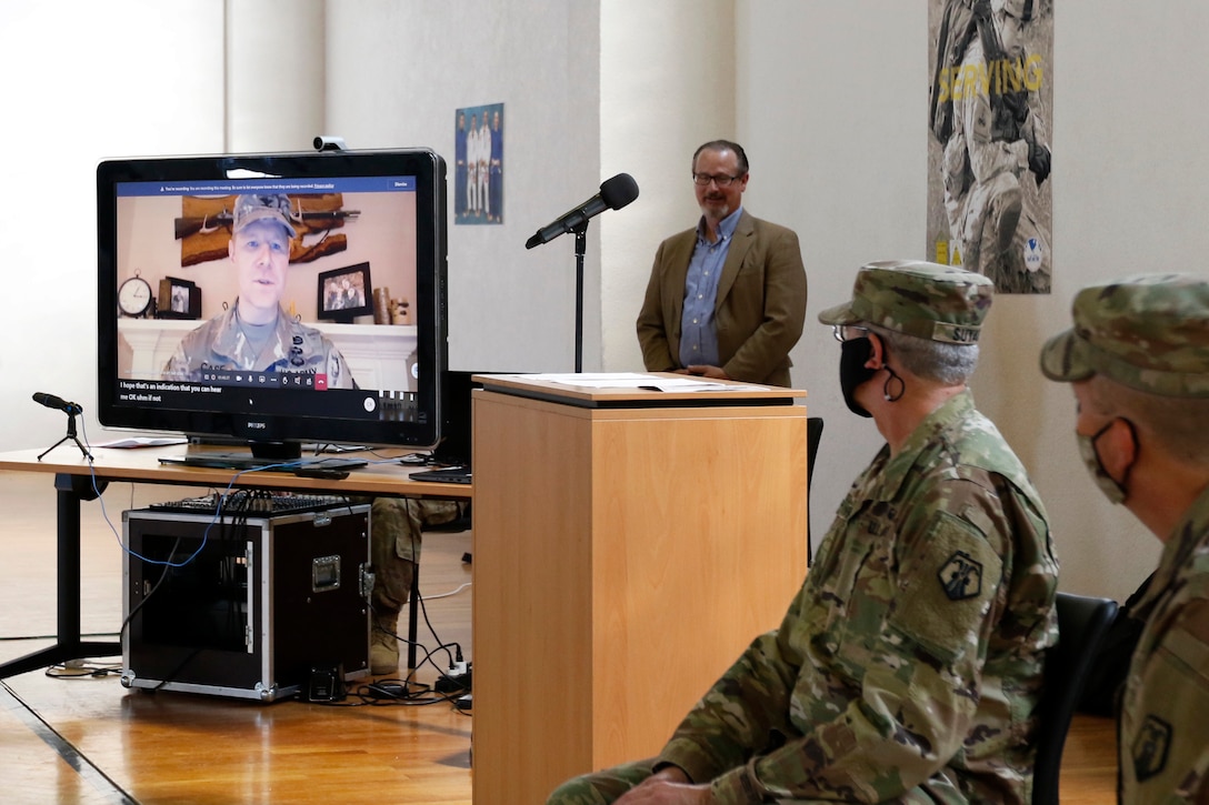 Col. Stephen P. Case, left, speaks to his unit, the 209th Digital Liaison Detachment, during a change of command ceremony July 19, 2020 in Wackernheim, Germany. The detachment, headquartered at U.S. Army Garrison Wiesbaden, is part of the U.S. Army Reserve’s 7th Mission Support Command and serves in direct support of U.S. Army Europe.  (U.S. Army Reserve photo by Staff Sgt. Chris Jackson/Released)