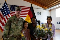 Lt. Col. Frank Suyak and family pose after taking command of the 209th Digital Liaison Detachment July 19, 2020 in Wackernheim, Germany. The detachment, headquartered at U.S. Army Garrison Wiesbaden, is part of the U.S. Army Reserve’s 7th Mission Support Command and serves in direct support of U.S. Army Europe.  (U.S. Army Reserve photo by Staff Sgt. Chris Jackson/Released)
