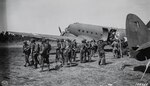 Soldiers with the 2nd Battalion, 127th Infantry, 32nd Division, deplane at the Dubadura Airstrip south of Buna, New Guinea, Dec. 15, 1942.