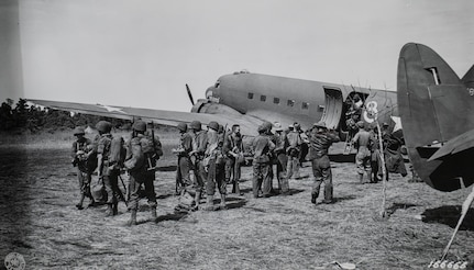 Soldiers with the 2nd Battalion, 127th Infantry, 32nd Division, deplane at the Dubadura Airstrip south of Buna, New Guinea, Dec. 15, 1942.