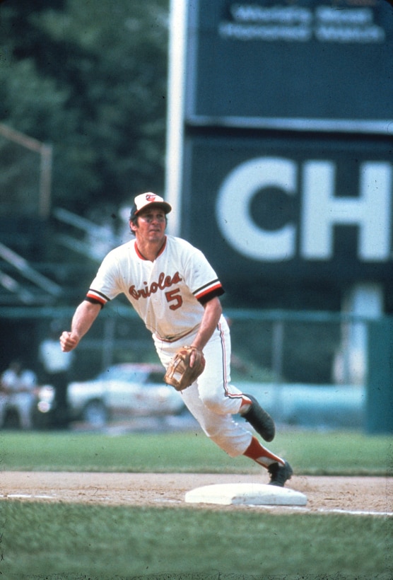 A man plays baseball.