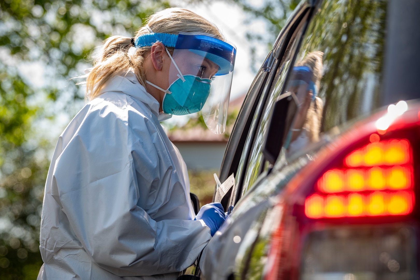 A West Virginia National Guard Airman provides a COVID-19 test to a citizen on May 22, 2020, in Charleston, W.Va.