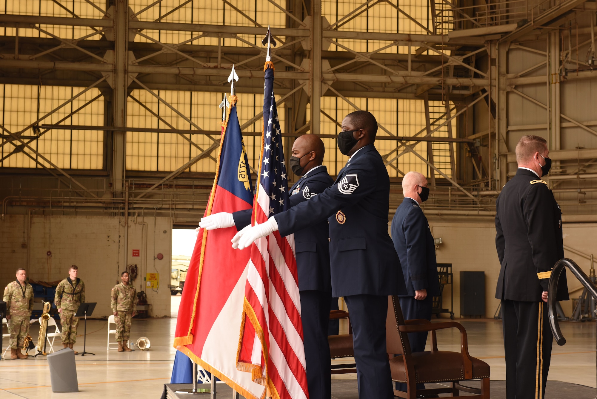 The 145th Airlift Wing Honor Guard posts the Colors during the promotion ceremony of U.S. Air Force Col. Allan R. Cecil, North Carolina National Guard Chief of Staff, held at the North Carolina Air National Guard Base, Charlotte Douglas International Airport, July 18, 2020. Family, friends, and guard members gather to watch Col. Cecil pin on the rank of Brigadier General.