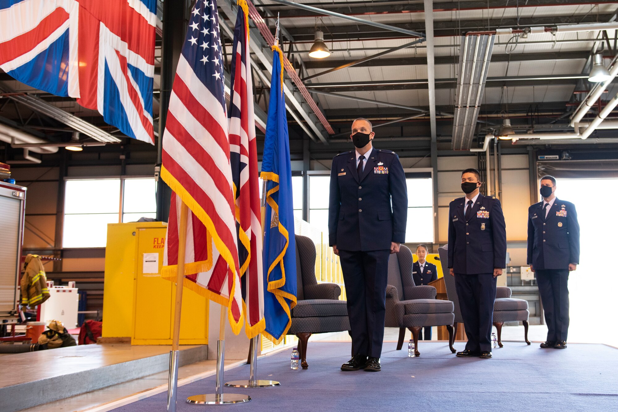 U.S. Air Force Col. Christopher Bromen, left, 423rd Air Base Group commander, Maj. Chin T. Hsu, center, 423rd Civil Engineer Squadron (CES) outgoing commander, and Maj. Hans Winkler, right, 423rd CES incoming commander, stand at attention for the playing of the national anthem during a change of command ceremony at RAF Alconbury, England, July 17, 2020. The change of command ceremony is rooted in military history dating back to the 18th century representing the relinquishing of power from one officer to another. (U.S. Air Force photo by Airman 1st Class Jennifer Zima)