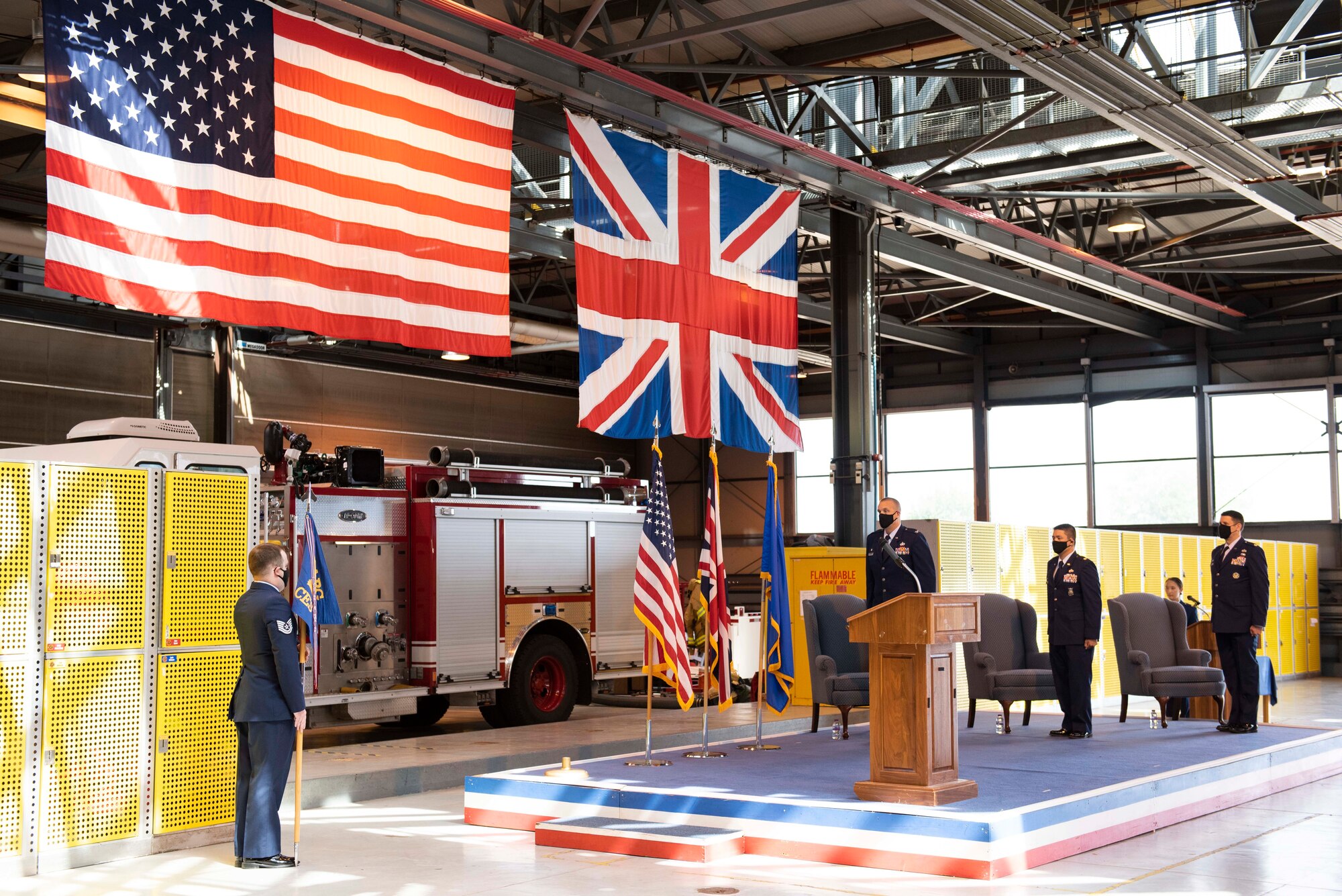 U.S. Air Force Col. Christopher Bromen, left, 423rd Air Base Group commander, Maj. Chin T. Hsu, center, 423rd Civil Engineer Squadron (CES) outgoing commander, and Maj. Hans Winkler, right, 423rd CES incoming commander, stand at attention for the playing of the national anthem during a change of command ceremony at RAF Alconbury, England, July 17, 2020. The change of command ceremony is rooted in military history dating back to the 18th century representing the relinquishing of power from one officer to another. (U.S. Air Force photo by Airman 1st Class Jennifer Zima)