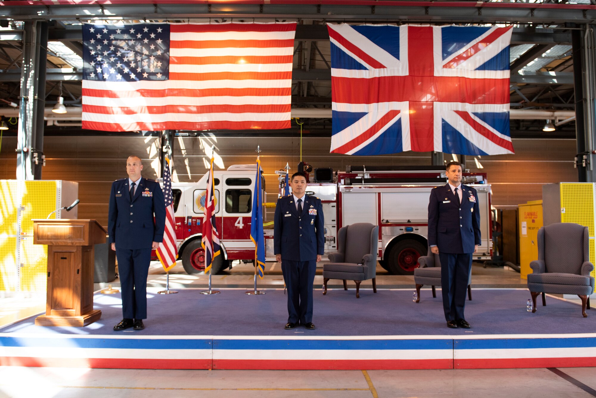 U.S. Air Force Col. Christopher Bromen, left, 423rd Air Base Group commander, Maj. Chin T. Hsu, center, 423rd Civil Engineer Squadron (CES) outgoing commander, and Maj. Hans Winkler, right, 423rd CES incoming commander, stand at attention during the 423rd CES Change of Command ceremony at RAF Alconbury, England, July 17, 2020. The change of command ceremony is rooted in military history dating back to the 18th century representing the relinquishing of power from one officer to another. (U.S. Air Force photo by Airman 1st Class Jennifer Zima)