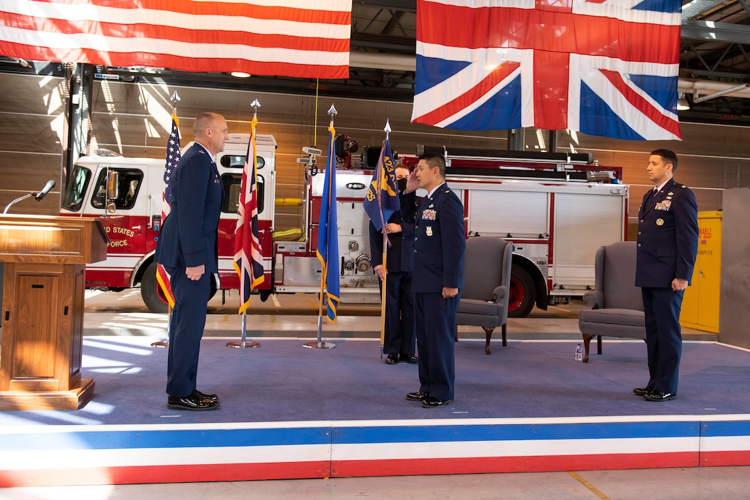 U.S. Air Force Maj. Chin T. Hsu, center, 423rd Civil Engineer Squadron outgoing commander, relinquishes command of the 423rd CES to Maj. Hans Winkler, right, 423rd CES incoming commander, during the 423rd CES Change of Command ceremony at RAF Alconbury, England, July 17, 2020. The change of command ceremony is rooted in military history dating back to the 18th century representing the relinquishing of power from one officer to another. (U.S. Air Force photo by Airman 1st Class Jennifer Zima)