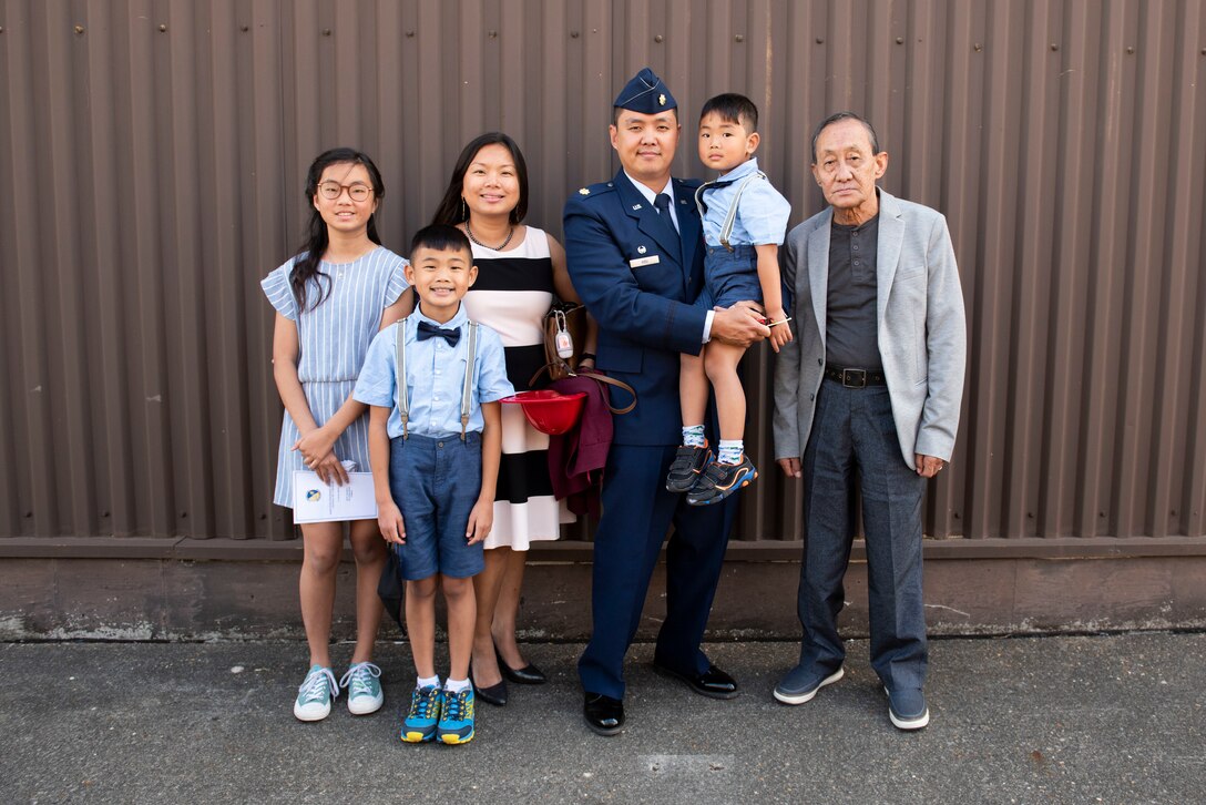 U.S. Air Force Maj. Chin T. Hsu, 423rd Civil Engineer Squadron (CES) outgoing commander, poses for a photo with his family during the 423rd CES Change of Command ceremony at RAF Alconbury, England, July 17, 2020. The change of command ceremony is rooted in military history dating back to the 18th century representing the relinquishing of power from one officer to another. (U.S. Air Force photo by Airman 1st Class Jennifer Zima)