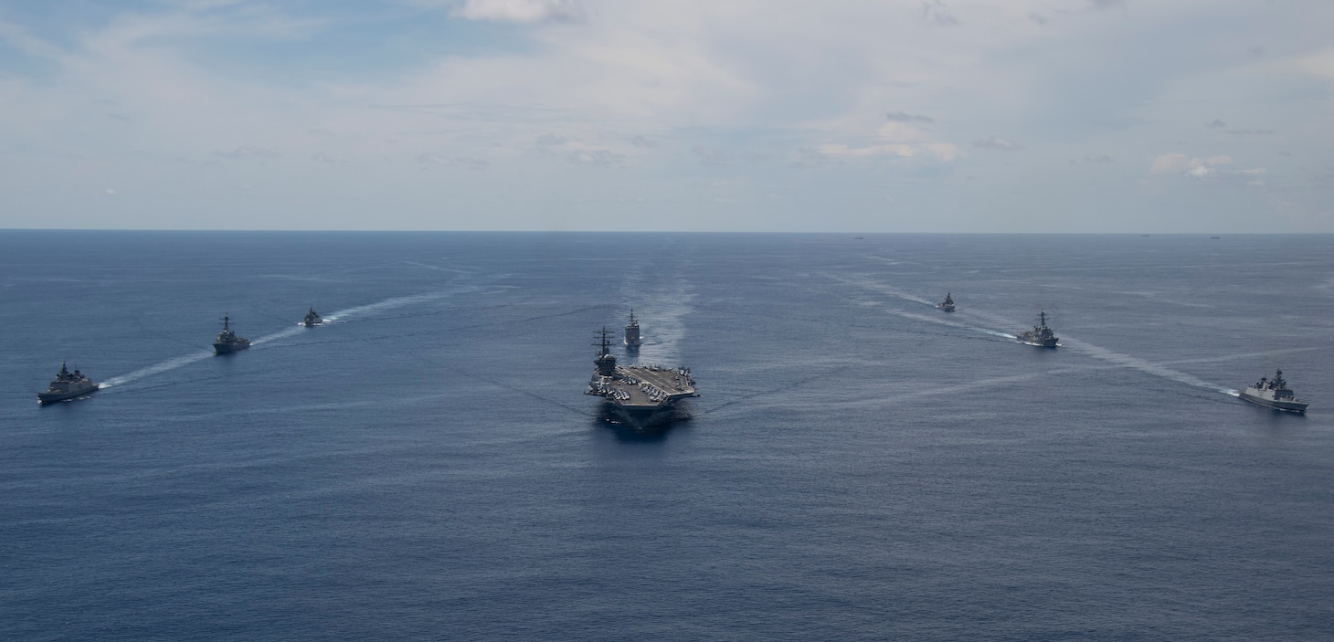 The Nimitz Carrier Strike Group, consisting of flagship USS Nimitz (CVN 68),  Ticonderoga-class guided missile cruiser USS Princeton (CG 59), and Arleigh Burke-class guided missile destroyers USS Sterett (DDG 104) and USS Ralph Johnson (DDG 114), along with Indian Navy ships Rana, Sahyadri, Shivalik and Kamorta, steam in formation during a cooperative deployment in the Indian Ocean June 20.