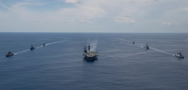 the nimitz carrier strike group, consisting of flagship uss nimitz (cvn 68),  ticonderoga-class guided missile cruiser uss princeton (cg 59), and arleigh burke-class guided missile destroyers uss sterett (ddg 104) and uss ralph johnson (ddg 114), along with indian navy ships rana, sahyadri, shivalik and kamorta, steam in formation during a cooperative deployment in the indian ocean june 20.