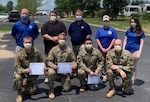 The Virginia Department of Emergency Management’s Region 7 (Northern Virginia) staff recognizes Virginia National Guard Soldiers who helped process personal protective equipment requests at their Regional Logistics Warehouse.