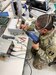 Spc. Nguyenquanghu Phan repairs a ventilator at the U.S. Army Medical Materiel Agency’s Medical Maintenance Operations Division at Tobyhanna Army Depot in Pennsylvania during a recent deployment. Sherman and eight other Soldiers from the 6th Medical Logistics Management Center at Fort Detrick, Maryland, deployed to USAMMA’s three MMOD’s to supplement the workforce during the COVID-19 response as each depot saw spikes in work order requests.