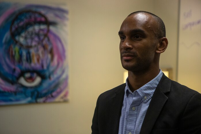 U.S. Navy veteran Ian Beard, a psychiatric technician, poses for a photo after discussing the benefits of group therapy on Marine Corps Base Camp Pendleton, California, July 15.