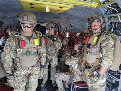 Paratroopers from Bravo Company, 2nd Battalion, 19th Special Forces Group, conduct military free-fall exercise out of a New York National Guard Chinook. Pilots from Detachment 1, Bravo Company, 3rd Battalion, 126th Regiment, supported this operation in Camp Dawson, West Virginia, July 11, 2020.