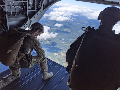 Paratroopers from Bravo Company, 2nd Battalion, 19th Special Forces Group, conduct military free-fall exercise out of a New York National Guard Chinook helicopter. Pilots from Detachment 1, Bravo Company, 3rd Battalion, 126th Regiment, supported this operation from Camp Dawson, West Virginia, July 11, 2020.