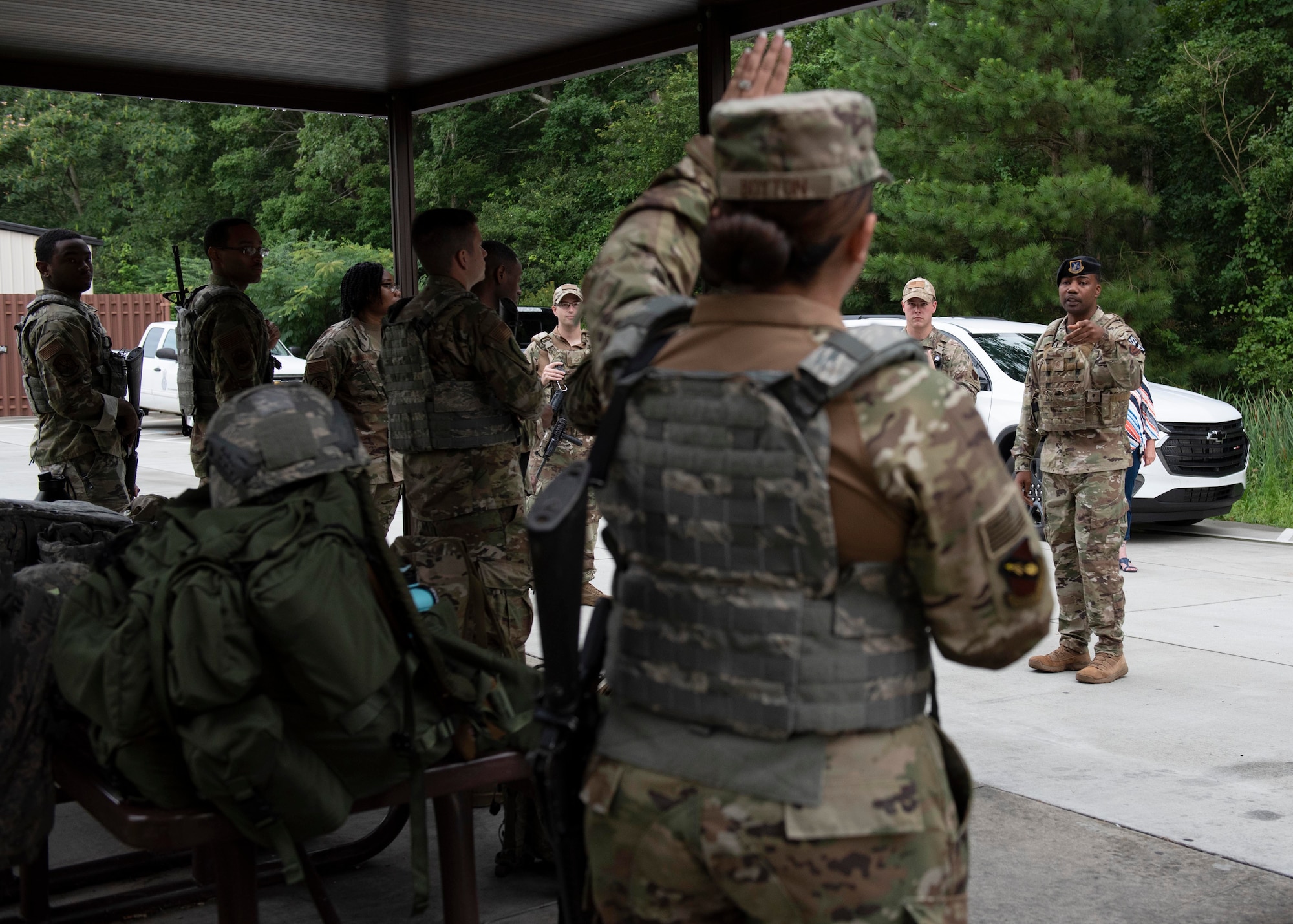 Airman Leadership School graduates ask members of the Security Forces Squadron questions prior to beginning the combat skills training course at Seymour Johnson Air Force Base, North Carolina, July 13, 2020.