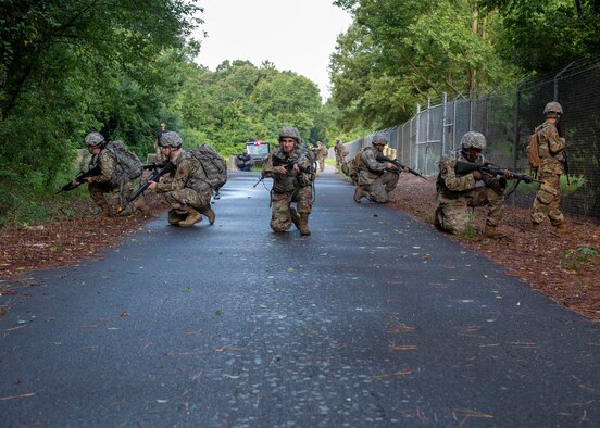 Airman Leadership School graduates conduct a danger crossing during a combat skills training course at Seymour Johnson Air Force Base, North Carolina, July 13, 2020.