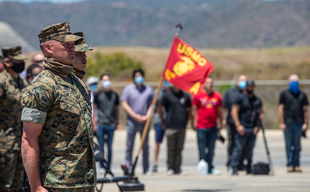 U.S. Marine Capt. Mark Rothrock, left, the company commander of Alpha Company, 4th Tank Battalion, 4th Marine Division, Marine Force Reserve, and 1st Sgt. Adam Casas, the company first sergeant of Alpha Co., 4th Tank Bn., 4th MarDiv, MARFORRES, stand at attention during the company’s deactivation ceremony in 41 Area on Marine Corps Base Camp Pendleton, California, July 18, 2020. Alpha Co., along with the rest of 4th Tank Bn., was activated in 1943 during World War II. Since then, the battalion has participated in every war the Marine Corps has fought in. Alpha Co. is the first of 4th Tanks’ six companies to deactivate. The Marine Corps is divesting its tank battalions following the commandant’s guidance in Force Design 2030. Casas is a native of Murrieta, California, and Rothrock is a native of Raleigh, North Carolina. (U.S. Marine Corps photo by Lance Cpl. Andrew Cortez)