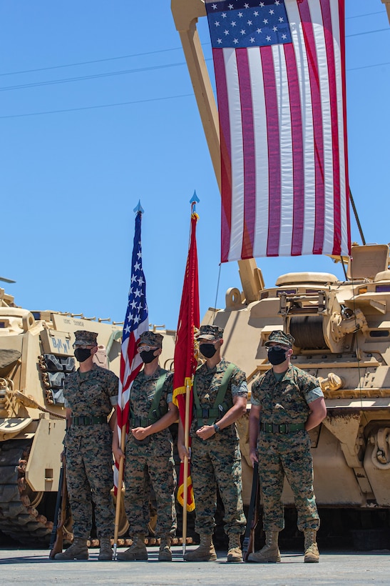 U.S. Marines in the color guard with Alpha Company, 4th Tank Battalion, 4th Marine Division, Marine Forces Reserve, stand at parade rest prior to the company’s deactivation ceremony in 41 Area on Marine Corps Base Camp Pendleton, California, July 18, 2020. Alpha Co., along with the rest of 4th Tank Bn., was activated in 1943 during World War II. Since then, the battalion has participated in every war the Marine Corps has fought in. Alpha Co. is the first of 4th Tanks’ six companies to deactivate. The Marine Corps is divesting its tank battalions following the commandant’s guidance in Force Design 2030. (U.S. Marine Corps photo by Lance Cpl. Andrew Cortez)