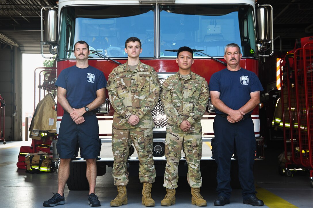 From left, 316th Civil Engineer Squadron firefighters Aidan Custer, Airman 1st Class Colton Clifton, Airman 1st Class Josiah Jordan and Donald Simms pose for a photo at Fire Station One on Joint Base Andrews, Md., July 17, 2020.