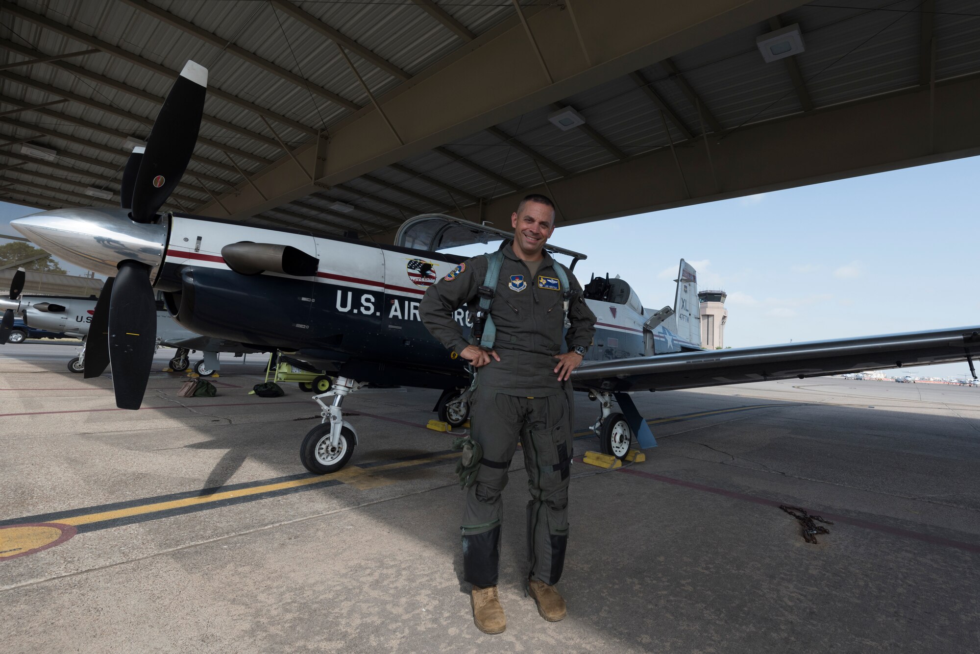Col. Lee Gentile, 47th Flying Training Wing commander, stands in front of a T-6 Texan II, July 17, 2020 at Laughlin Air Force Base Texas. Like all other instructor pilots of Team XL, Gentile attended pilot instructor training. This enabled him to impart his years’ worth of knowledge and experience to the younger instructor pilots of the flying training squadrons here. (U.S. Air Force photo by Senior Airman Anne McCready)