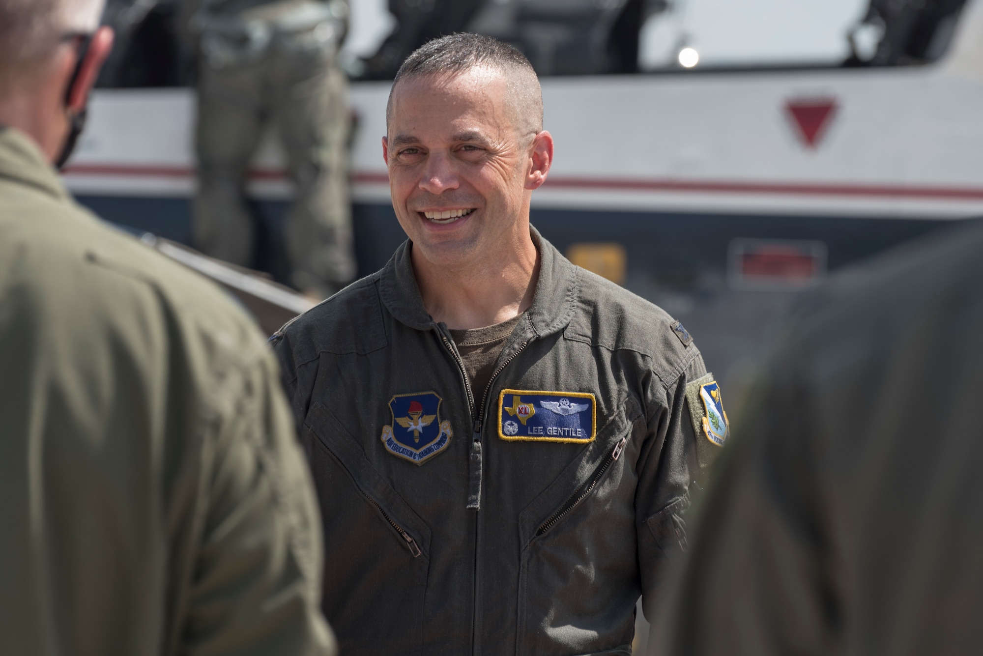 Col. Lee Gentile, 47th Flying Training Wing commander, says farewells to members of Team XL after his fini flight, July 17, 2020 at Laughlin Air Force Base Texas. His next assignment is Air Command and Staff College commandant at Maxwell AFB, Alabama. (U.S. Air Force photo by Senior Airman Anne McCready)