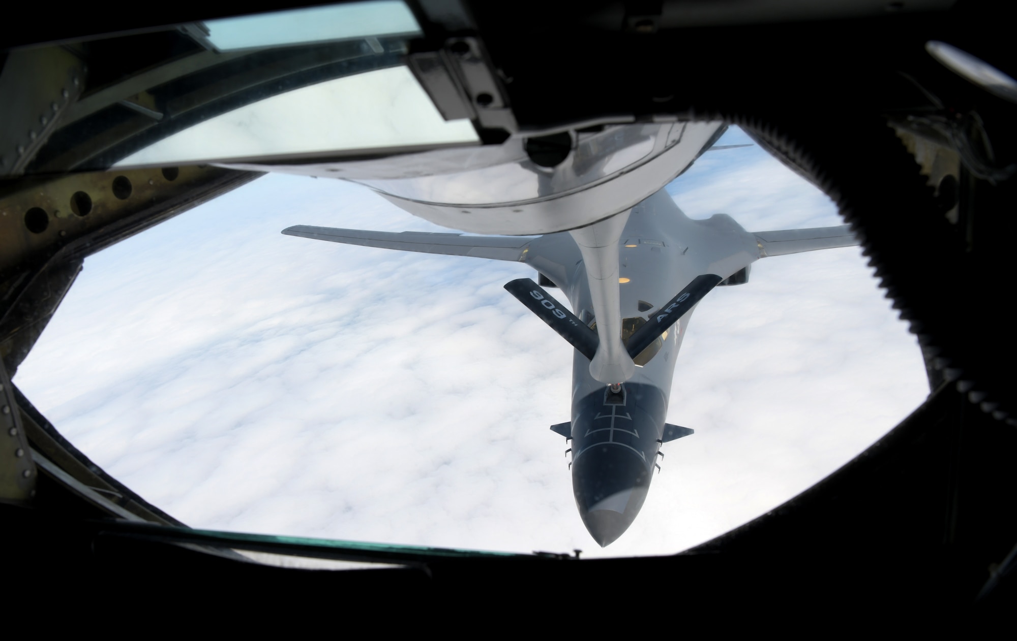A U.S. Air Force B-1B Lancer from the 28th Bomb Wing, Ellsworth Air Force Base, S.D., approaches a KC-135 Stratotanker from the 909th Air Refueling Squadron, to refuel over the Pacific as part of a bilateral U.S. Indo-Pacific Command and U.S. Strategic Command (USSTRACTCOM) Bomber Task Force (BTF) mission July 17, 2020.  This operation demonstrates the U.S. Air Force’s dynamic force employment model in line with the National Defense Strategy’s objectives of strategic predictability with persistent bomber presences, assuring allies and partners. (U.S. Air Force photo by Airman 1st Class Rebeckah Medeiros)