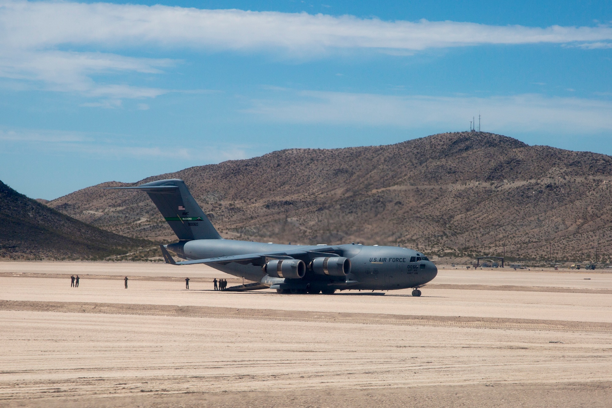 C-17 sitting on dirt runway