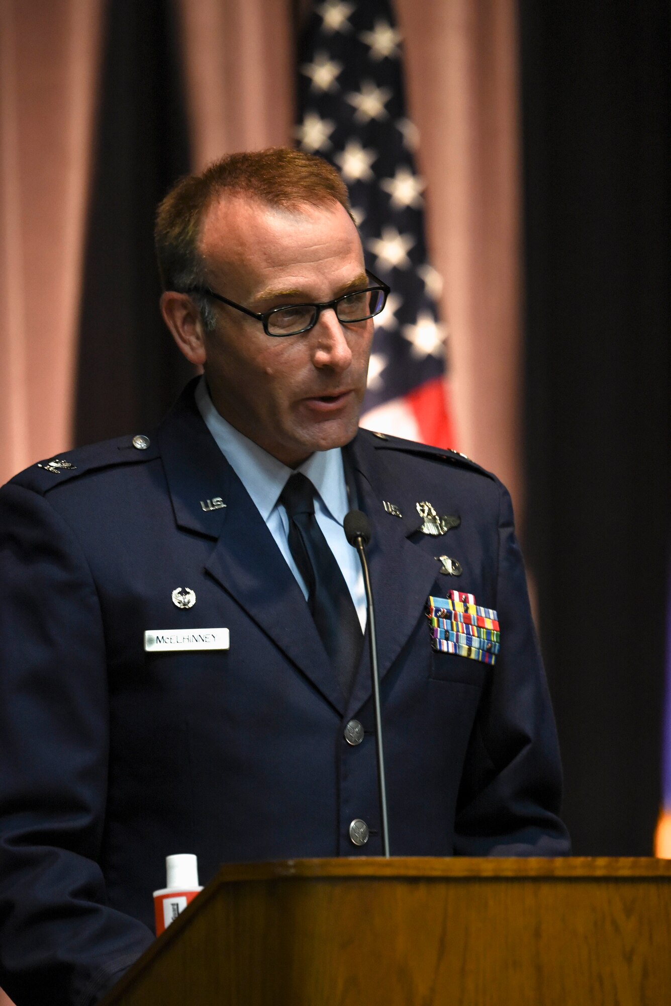 U.S. Air Force Col. Tom McElhinney III, 14th Operations Group commander, speaks at Specialized Undergraduate Pilot Training Class 20-18/19 graduation ceremony July 10, 2020, on Columbus Air Force Base, Miss. After graduating pilot training at Columbus AFB, pilots will now go to their specified base to start training on their assigned aircraft. (U.S. Air Force photo by Senior Airman Keith Holcomb)