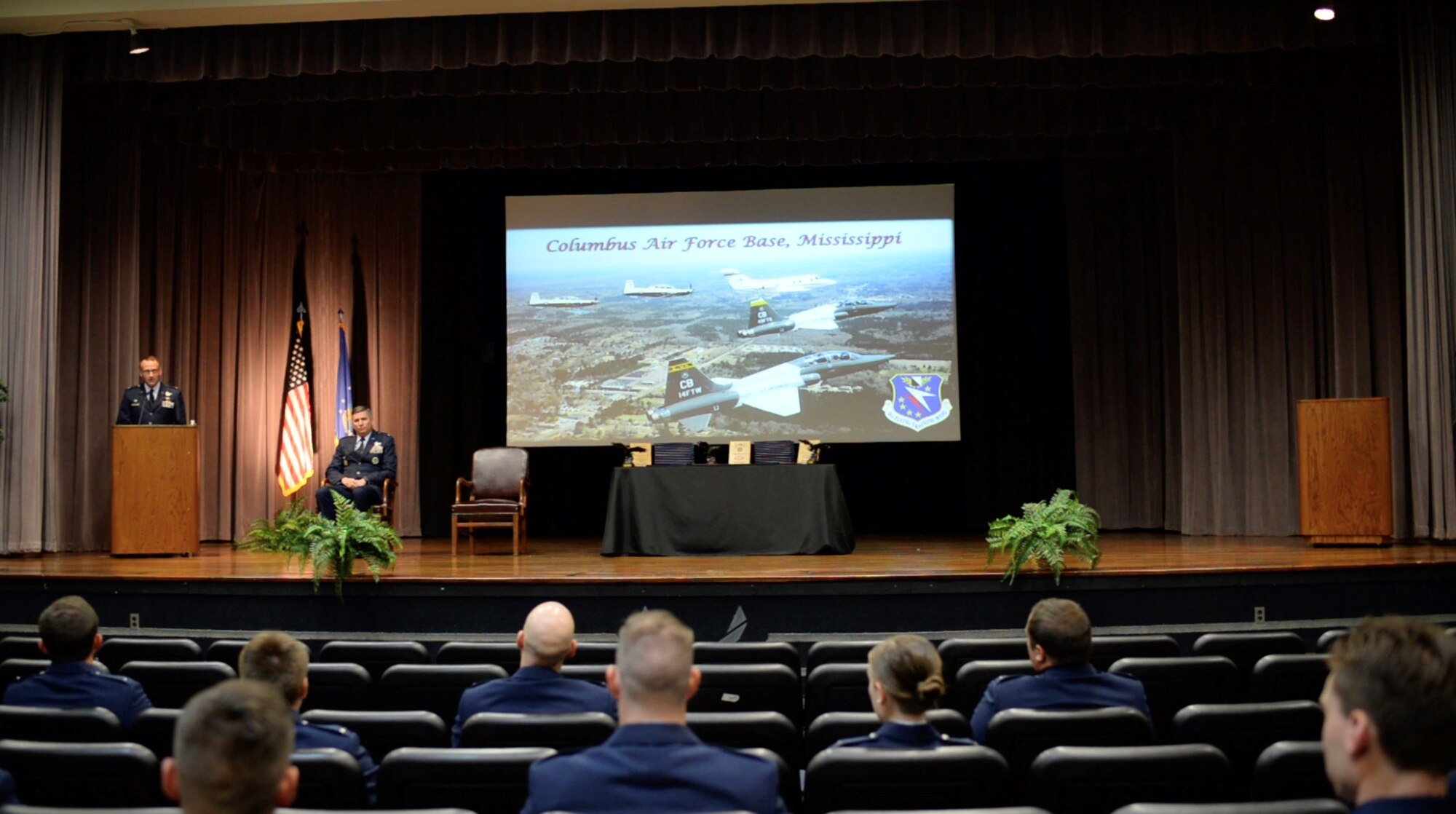 U.S. Air Force Col. Tom McElhinney III, 14th Operations Group commander, speaks at Specialized Undergraduate Pilot Training Class 20-18/19 graduation ceremony July 10, 2020, on Columbus Air Force Base, Miss. The 52-week pilot training program begins with a six-week preflight phase of academics and physiological training to prepare students for flight. (U.S. Air Force photo by Senior Airman Keith Holcomb)