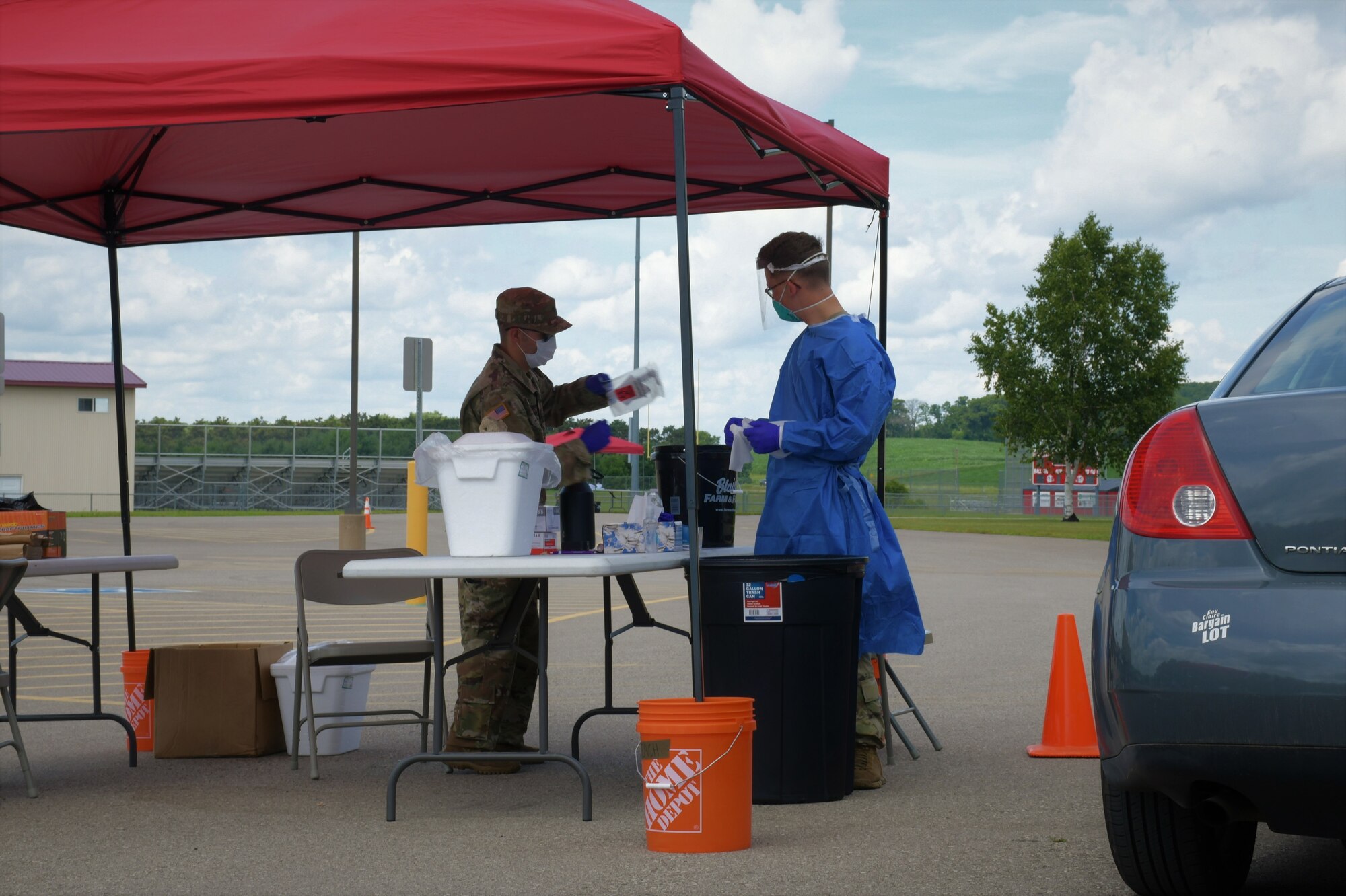 Citizen-Soldiers and Citizen-Airmen from the Wisconsin National Guard collect specimens for COVID-19 testing July 13, 2020, at a community-based test site at the Eleva-Strum High School in Strum, Wis. The Wisconsin National Guard has collected more than 256,000 specimens statewide.