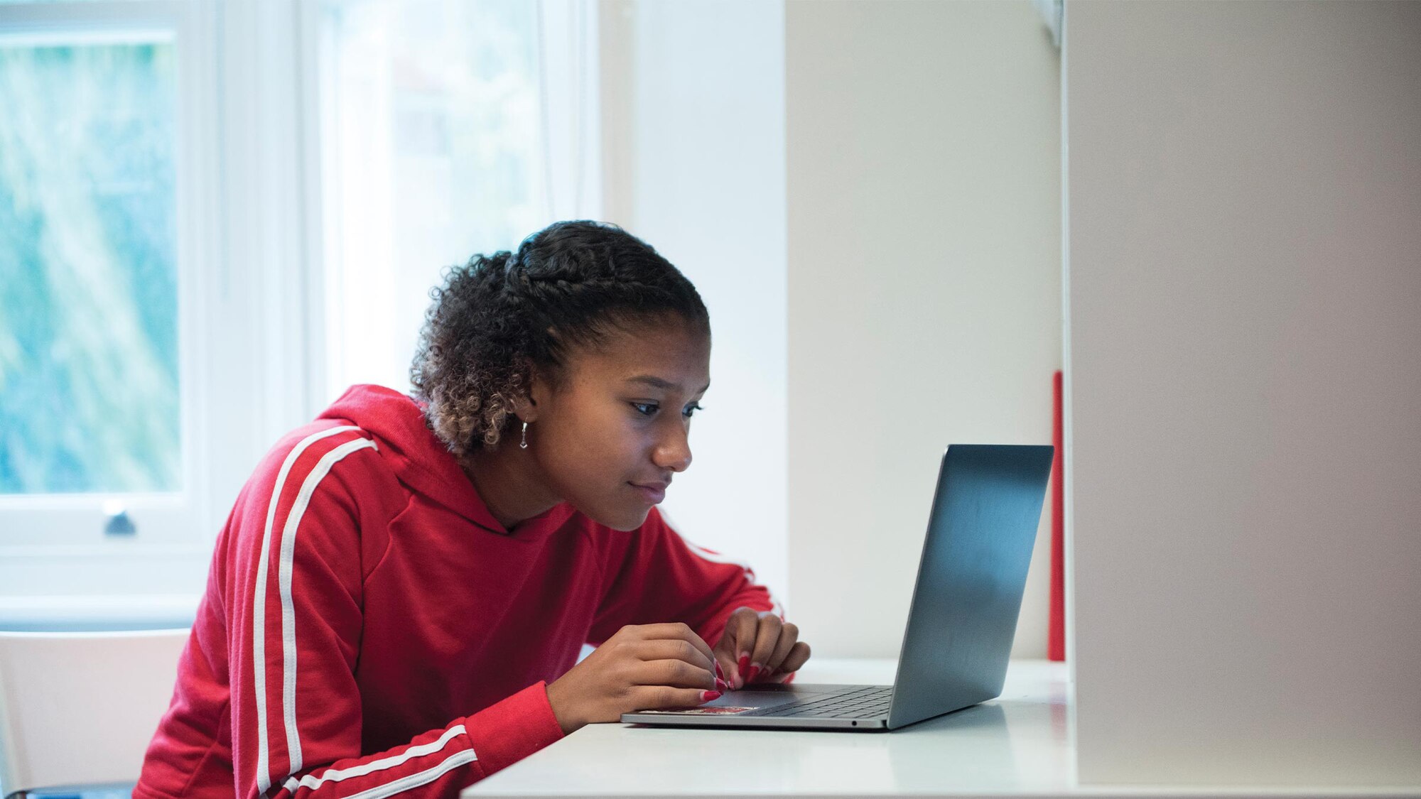 Girl looking at computer. (Courtesy photo)