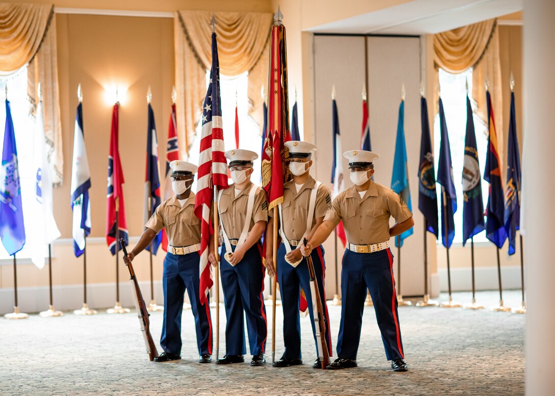 U.S. Marines with the 4th Marine Corps District color guard stand at parade rest during the district's change of command ceremony at the West Shore Country Club, Camp Hill, PA, July 16, 2020. After three years of service as the commanding officer of the 4th Marine Corps District, Col. Robert M. Clark relinquished his command to Col. Heather J. Cotoia during the ceremony.  (U.S. Marine Corps Photo by Cpl. Cody J. Ohira)