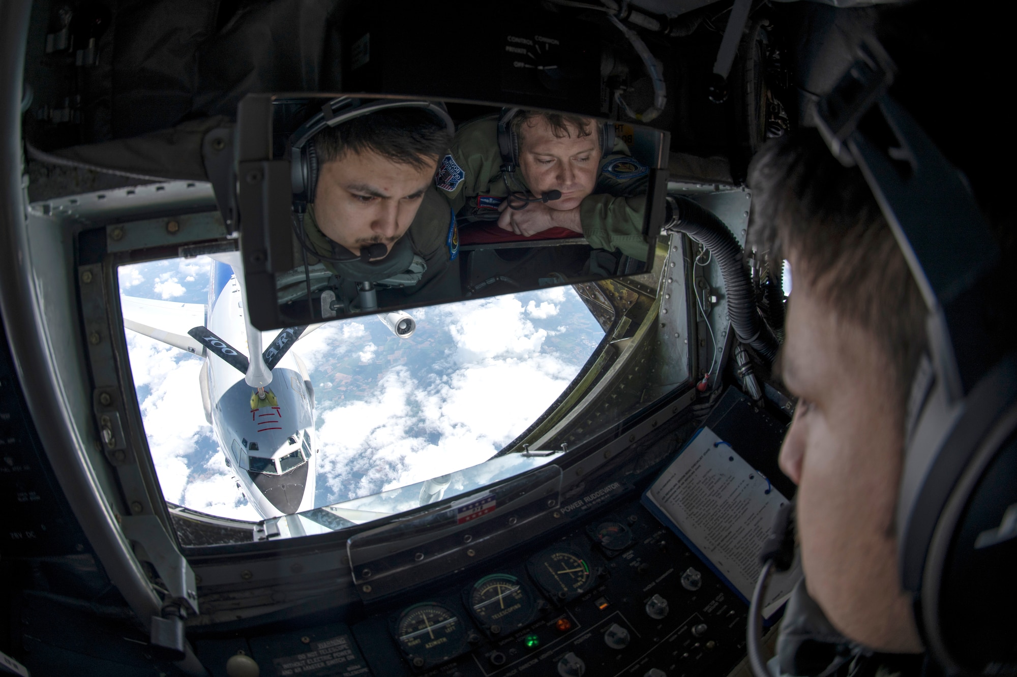 Airman 1st class David Liu, left, and Tech. Sgt. Brandon Roberts 351st Air Refueling Squadron boom operators, refuel a NATO E-3 Sentry from Geilenkirchen NATO Air Base over Germany, July 17, 2020. The 100th Air Refueling Wing is the only permanent U.S. air refueling wing in the European theater, providing the critical air refueling "bridge" which allows the Expeditionary Air Force to deploy around the globe at a moment's notice. (U.S. Air Force photo by Tech. Sgt. Emerson Nuñez)