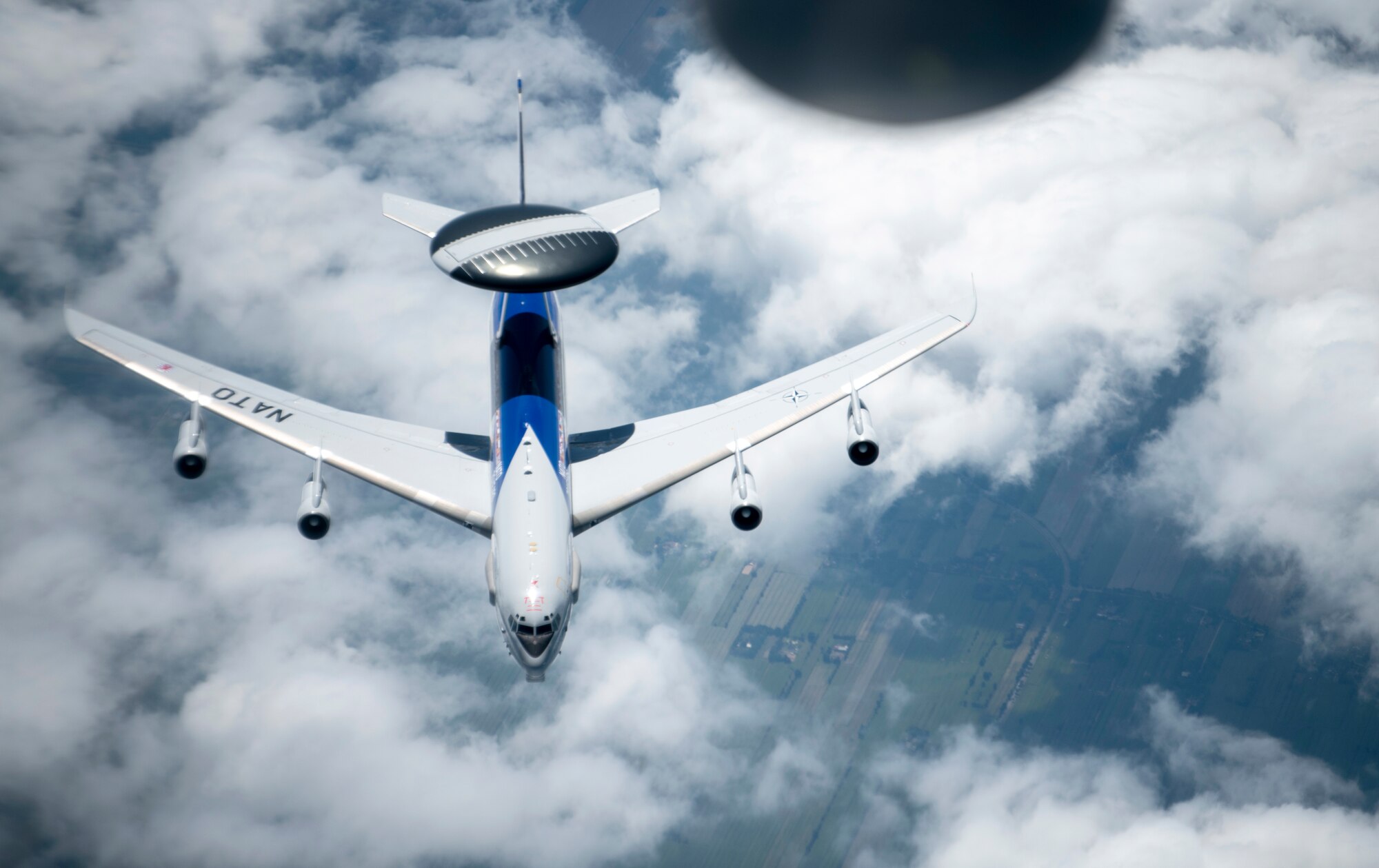A NATO E-3 Sentry from Geilenkirchen NATO Air Base breaks away from a KC-135 Stratotanker from the 100th Air Refueling Wing, RAF Mildenhall, England, after receiving fuel over Germany, July 17, 2020. The 100th ARW is the only permanent U.S. air refueling wing in the European theater, providing the critical air refueling "bridge" which allows the Expeditionary Air Force to deploy around the globe at a moment's notice. (U.S. Air Force photo by Tech. Sgt. Emerson Nuñez)