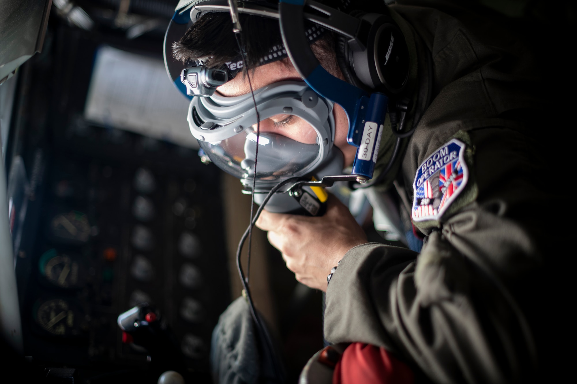 Airman 1st class David Liu, 351st Air Refueling Squadron boom operator, tests an oxygen mask before take-off aboard a KC-135 Stratotanker prior to a flight at RAF Mildenhall, England, July 17, 2020. The 100th Air Refueling Wing is the only permanent U.S. air refueling wing in the European theater, providing the critical air refueling "bridge" which allows the Expeditionary Air Force to deploy around the globe at a moment's notice. (U.S. Air Force photo by Tech. Sgt. Emerson Nuñez)