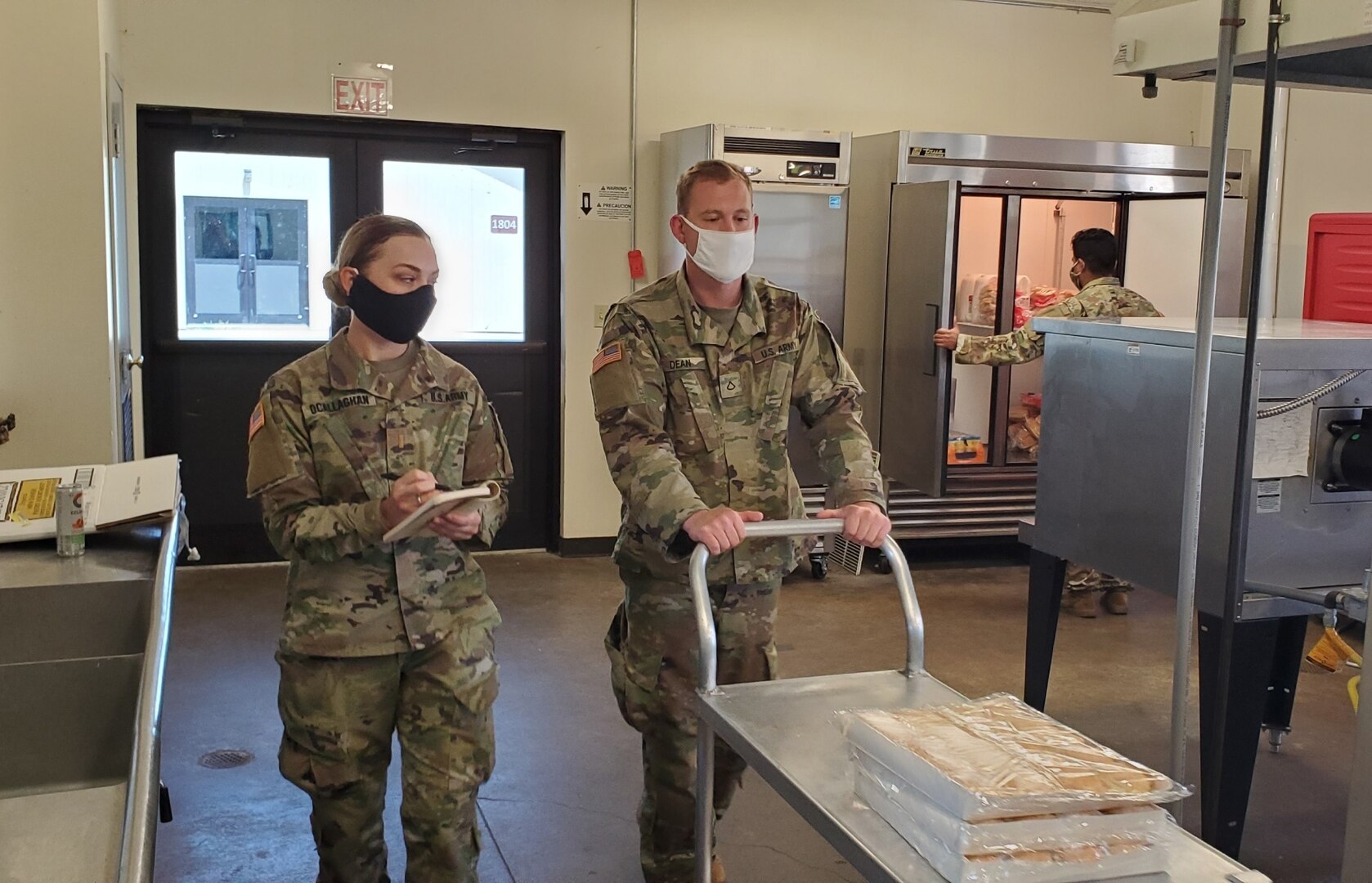 Second Lt. Colleen O’Callaghan, left, a platoon leader with the Ohio Army National Guard’s 1st Battalion, 148th Infantry Regiment, oversees her team June 9, 2020, at Second Harvest Food Bank of Clark, Champaign and Logan Counties in Springfield, Ohio. O’Callaghan, the Ohio National Guard’s first female Army infantry officer in its 232-year history, is one of many Guard members who volunteered to serve fellow Ohioans during the COVID-19 pandemic.