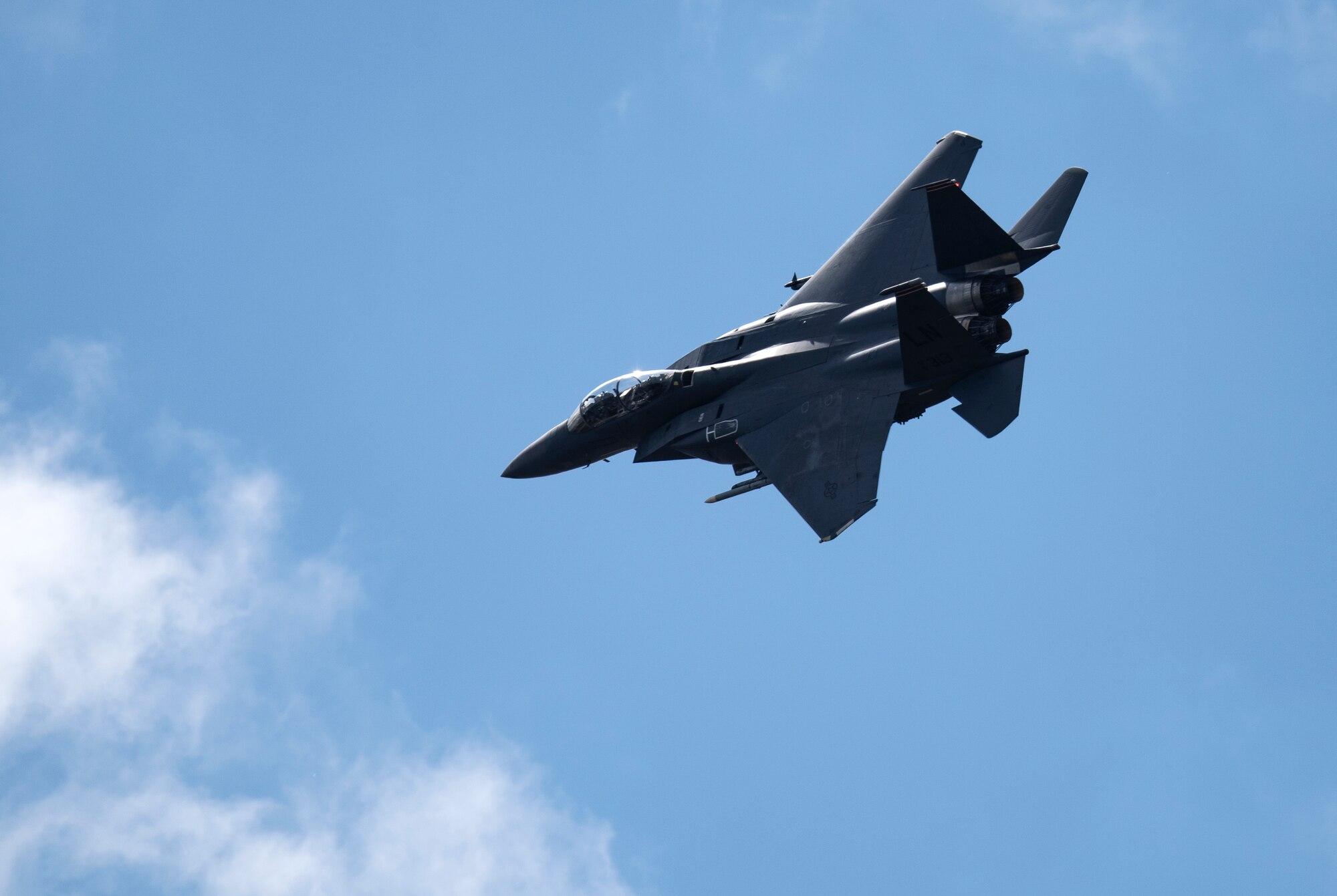 A U.S. Air Force F-15E Strike Eagle assigned to the 494th Fighter Squadron flies over Royal Air Force Lakenheath, England, July 20, 2020. The 494th FS conducts routine training to ensure the Liberty Wing brings unique air combat capabilities to the fight when called upon by U.S. Air Forces in Europe-Air Forces Africa. (U.S. Air Force photo by Airman 1st Class Jessi Monte)