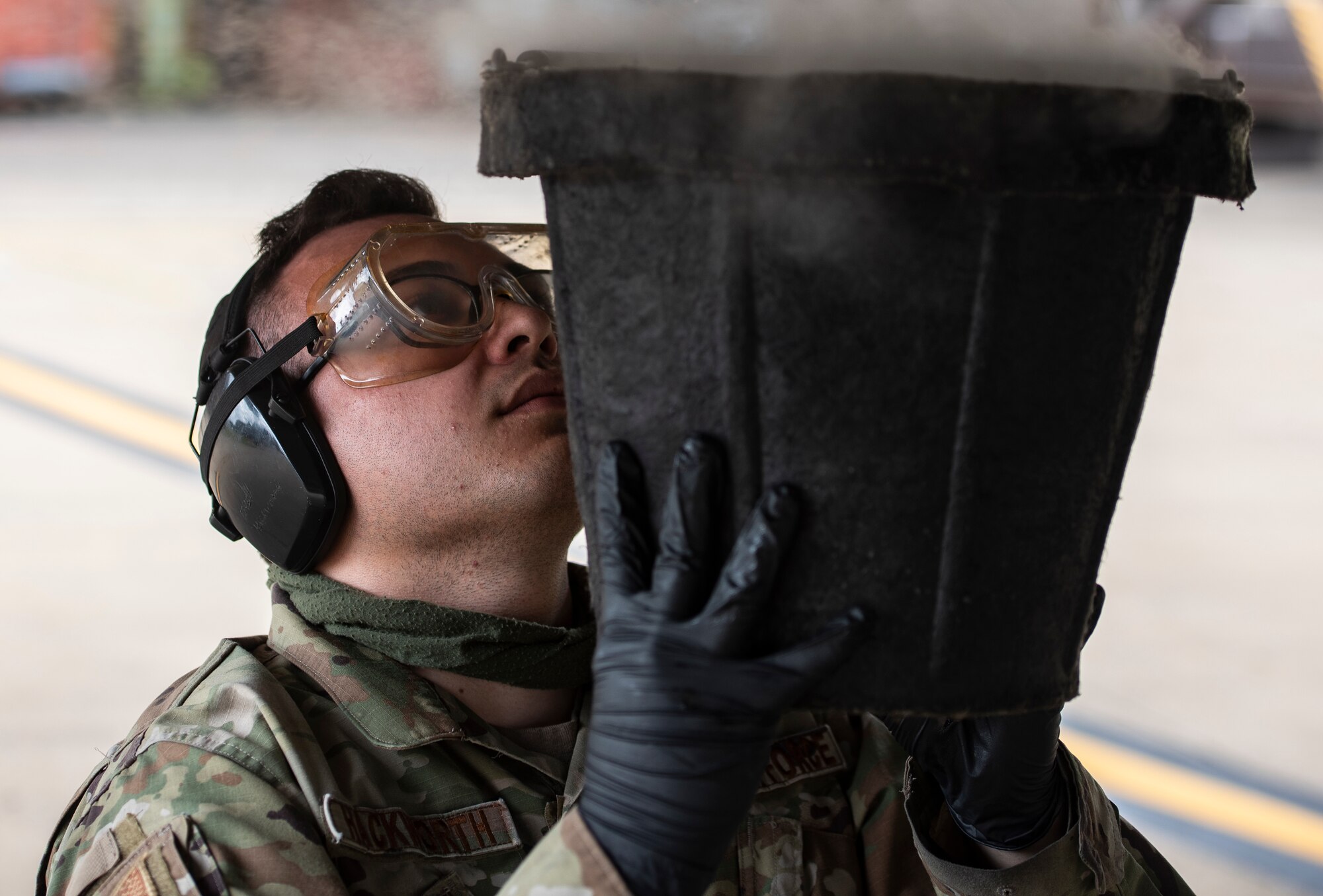 U.S. Air Force Airman 1st Class Nicholas Hackworth, a weapons load crew member assigned to the 748th Aircraft Maintenance Squadron, performs routine post-flight maintenance on an F15C Eagle at Royal Air Force Lakenheath, England, July 20, 2020. Aircraft maintainers perform various safety and function checks on aircraft including fluid levels, landing gear and flight control functionality, and running diagnostics on the electrical systems. (U.S. Air Force photo by Airman 1st Class Jessi Monte)