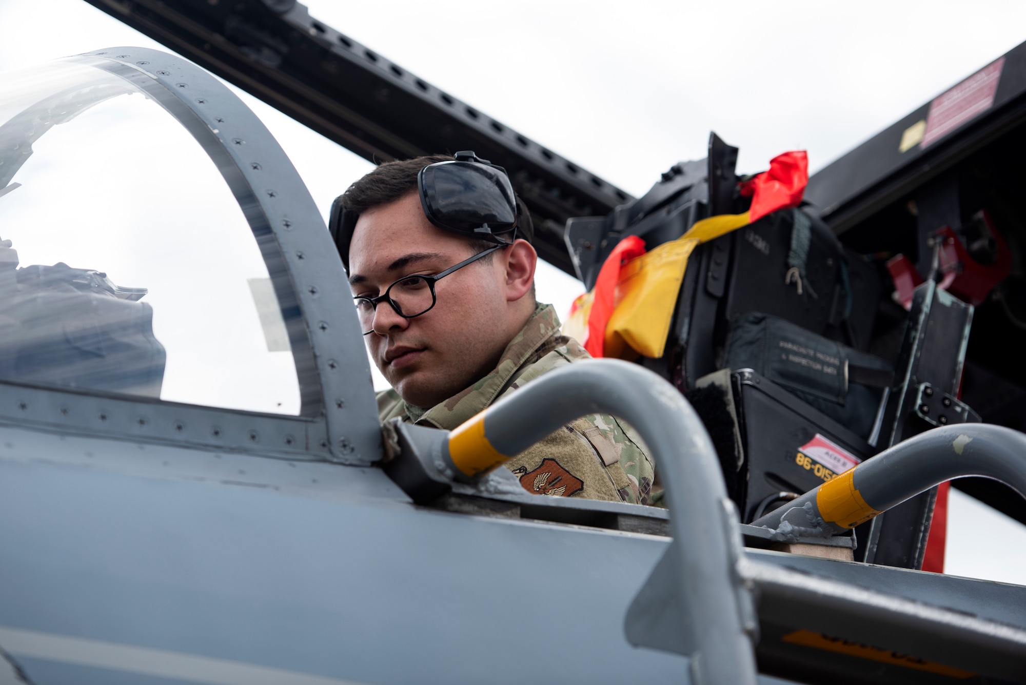 U.S. Air Force Airman 1st Class Nicholas Hackworth, a weapons load crew member assigned to the 748th Aircraft Maintenance Squadron, performs routine post-flight maintenance on an F15C Eagle at Royal Air Force Lakenheath, England, July 20, 2020. Aircraft maintainers perform various safety and function checks on aircraft including fluid levels, landing gear and flight control functionality, and running diagnostics on the electrical systems. (U.S. Air Force photo by Airman 1st Class Jessi Monte)