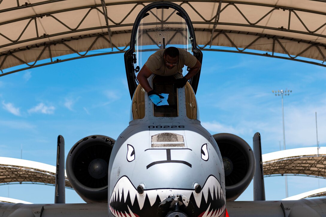 Photo of Airman cleaning a windscreen.