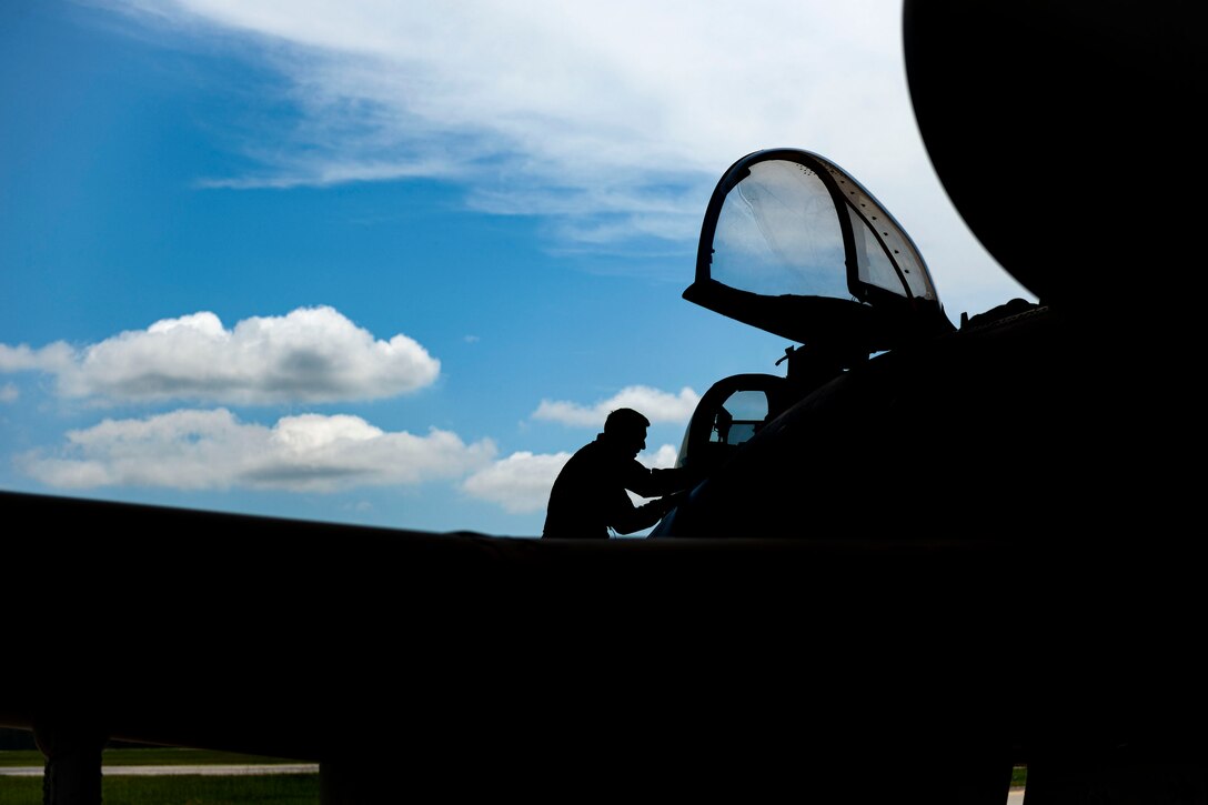 Photo of pilot entering an A-10.