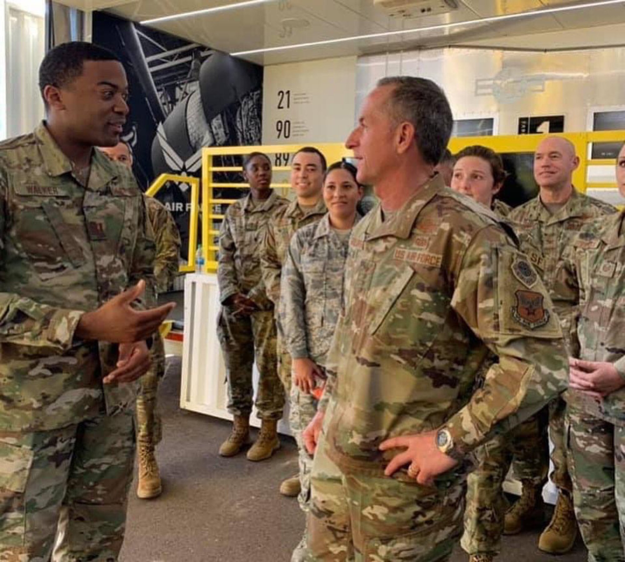 Air Force Chief of Staff Gen. David. L. Goldfein, right, talks to Capt. Jamail Walker, 362nd Recruiting Squadron support flight commander, during the Bluegreen Vacations 500 Monster Energy NASCAR race in Phoenix, Nov. 10, 2019.