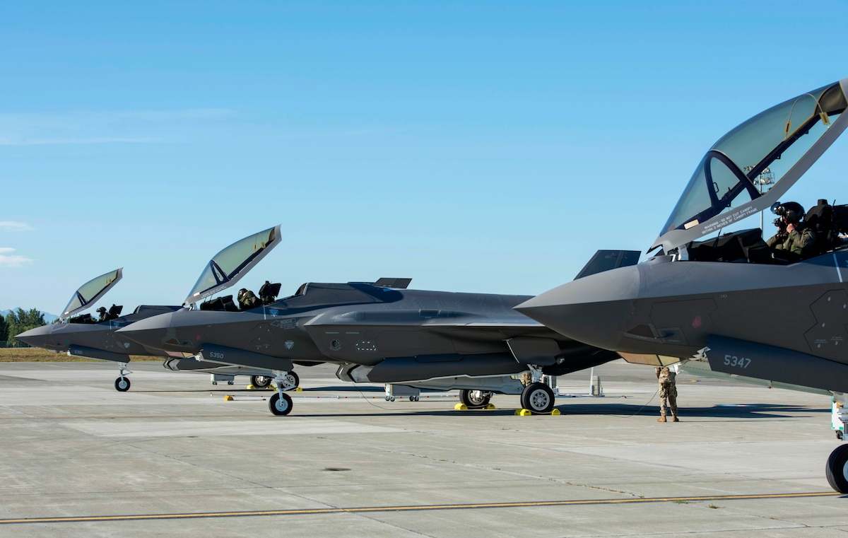 Three U.S. Air Force F-35A Lightning II pilots assigned to Eielson Air Force Base, Alaska, prepare to fly a training sortie out of Joint Base Elmendorf-Richardson, Alaska, July 14, 2020.