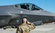 U.S. Air Force Airman 1st Class Lukas Turley, a 354th Aircraft Maintenance Squadron crew chief, salutes Maj. Brian Mueller, 356th Fighter Squadron assistant director of operations, both assigned to Eielson Air Force Base, Alaska, before taking off for a training sortie at Joint Base Elmendorf-Richardson, Alaska, July 14, 2020.