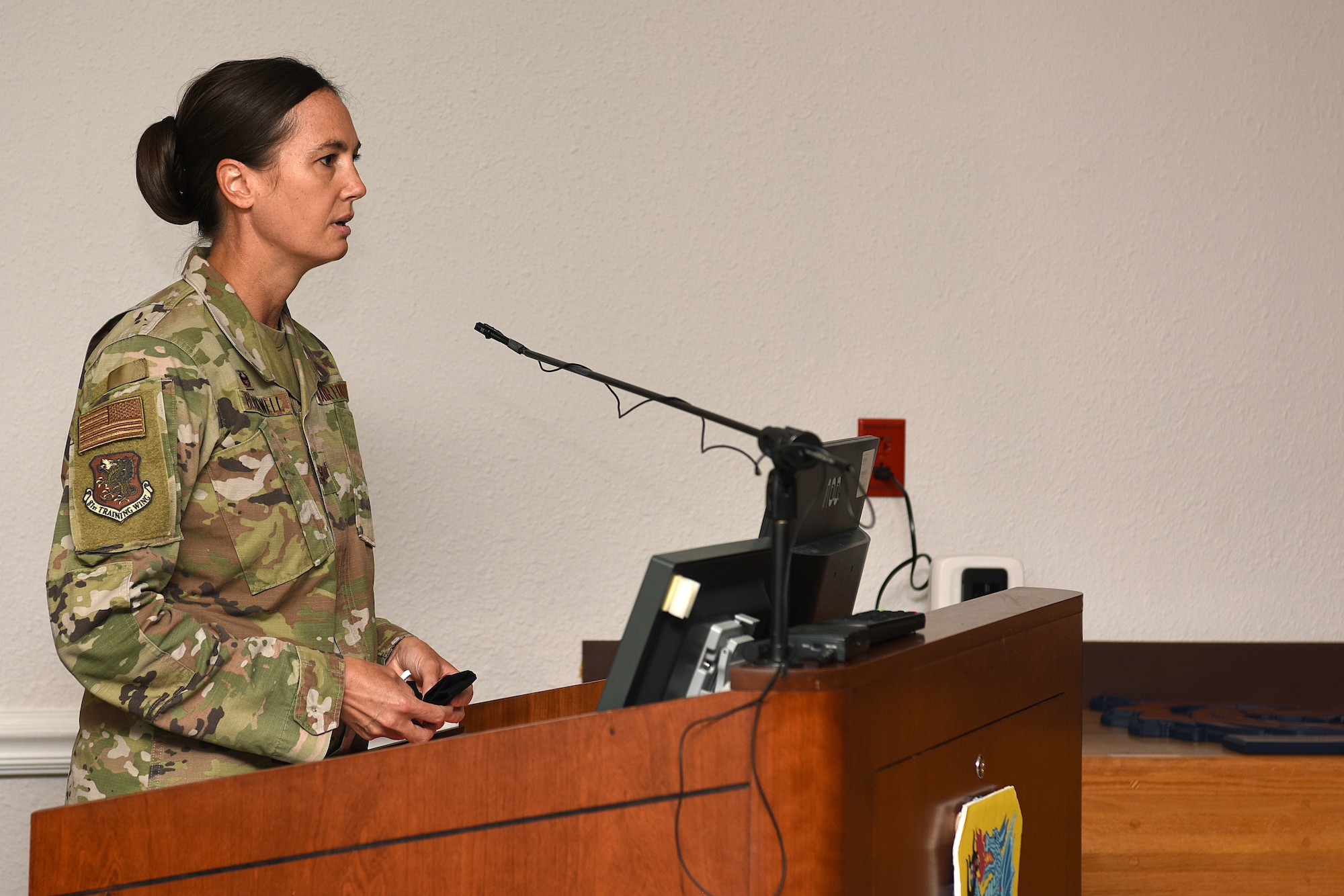 U.S. Air Force Col. Heather Blackwell, 81st Training Wing commander, delivers remarks during the 81st Medical Group change of command ceremony inside the Don Wiley Auditorium at Keesler Air Force Base, Mississippi, July 21, 2020. Col. Beatrice Dolihite, outgoing 81st MDG commander, relinquished command to Col. Christopher Estridge, incoming 81st MDG commander. (U.S. Air Force photo by Senior Airman Suzie Plotnikov)