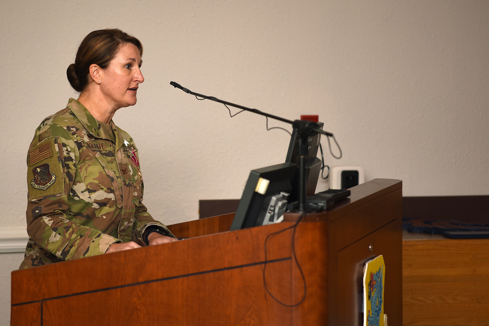 U.S. Air Force Col. Beatrice Dolihite, outgoing 81st Medical Group commander, delivers remarks during the 81st MDG change of command ceremony inside the Don Wiley Auditorium at Keesler Air Force Base, Mississippi, July 21, 2020. Dolihite relinquished command to Col. Christopher Estridge, incoming 81st MDG commander. (U.S. Air Force photo by Senior Airman Suzie Plotnikov)