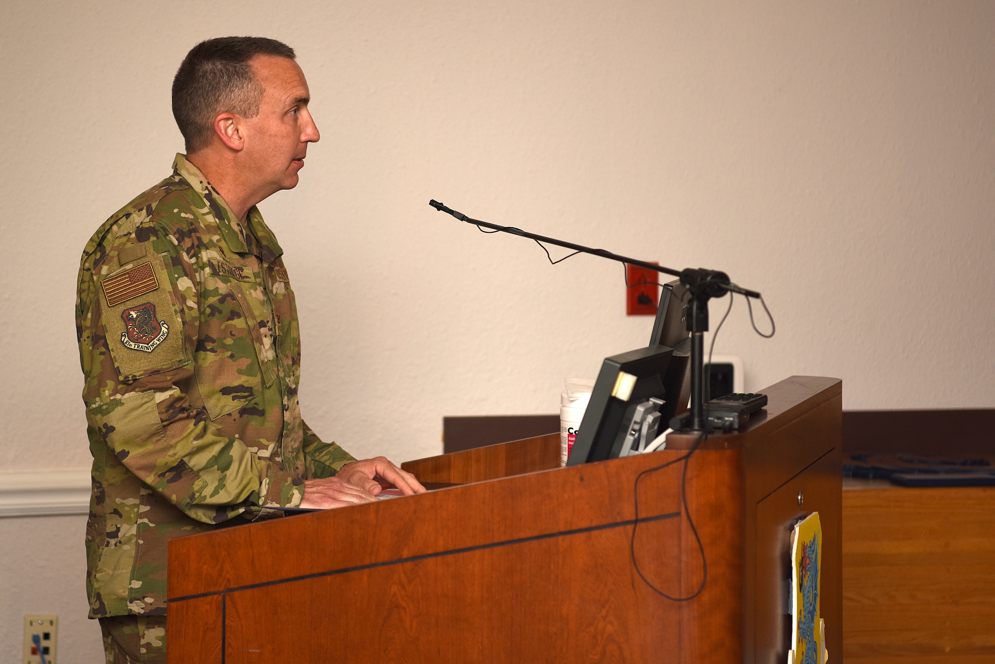 U.S. Air Force Col. Christopher Estridge, 81st Medical Group commander, delivers remarks during the 81st MDG change of command ceremony inside the Don Wiley Auditorium at Keesler Air Force Base, Mississippi, July 21, 2020. Col. Beatrice Dolihite, outgoing 81st MDG commander, relinquished command to Estridge. (U.S. Air Force photo by Senior Airman Suzie Plotnikov)