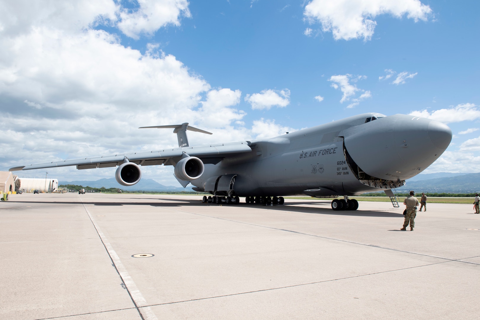 U.S. Airmen assigned to the 22nd Airlift Squadron, open the nose of a C-5M Super Galaxy to off-load cargo July 18, 2020, at Soto Cano Air Base, Honduras. The C-5M Super Galaxy is a strategic transport aircraft and is the largest aircraft in the Air Force inventory. Its primary mission is to transport cargo and personnel for the Department of Defense. (U.S. Air Force photo by Senior Airman Jonathon Carnell)