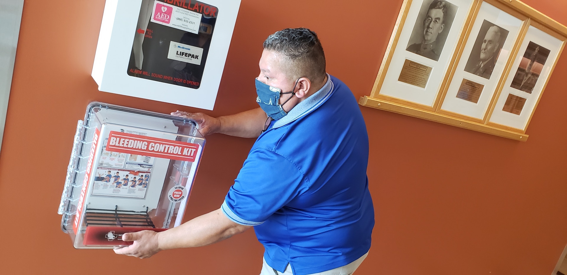 Chris Talamantez installs a “Stop the Bleed” kit at Brooke Army Medical Center, Fort Sam Houston, Texas, July 17, 2020. The kits, which contain items such as a tourniquet and trauma dressing, are part of the Stop the Bleed campaign, an initiative to aid an injured person in the event of uncontrolled bleeding. (U.S. Army photo by Corey Toy)